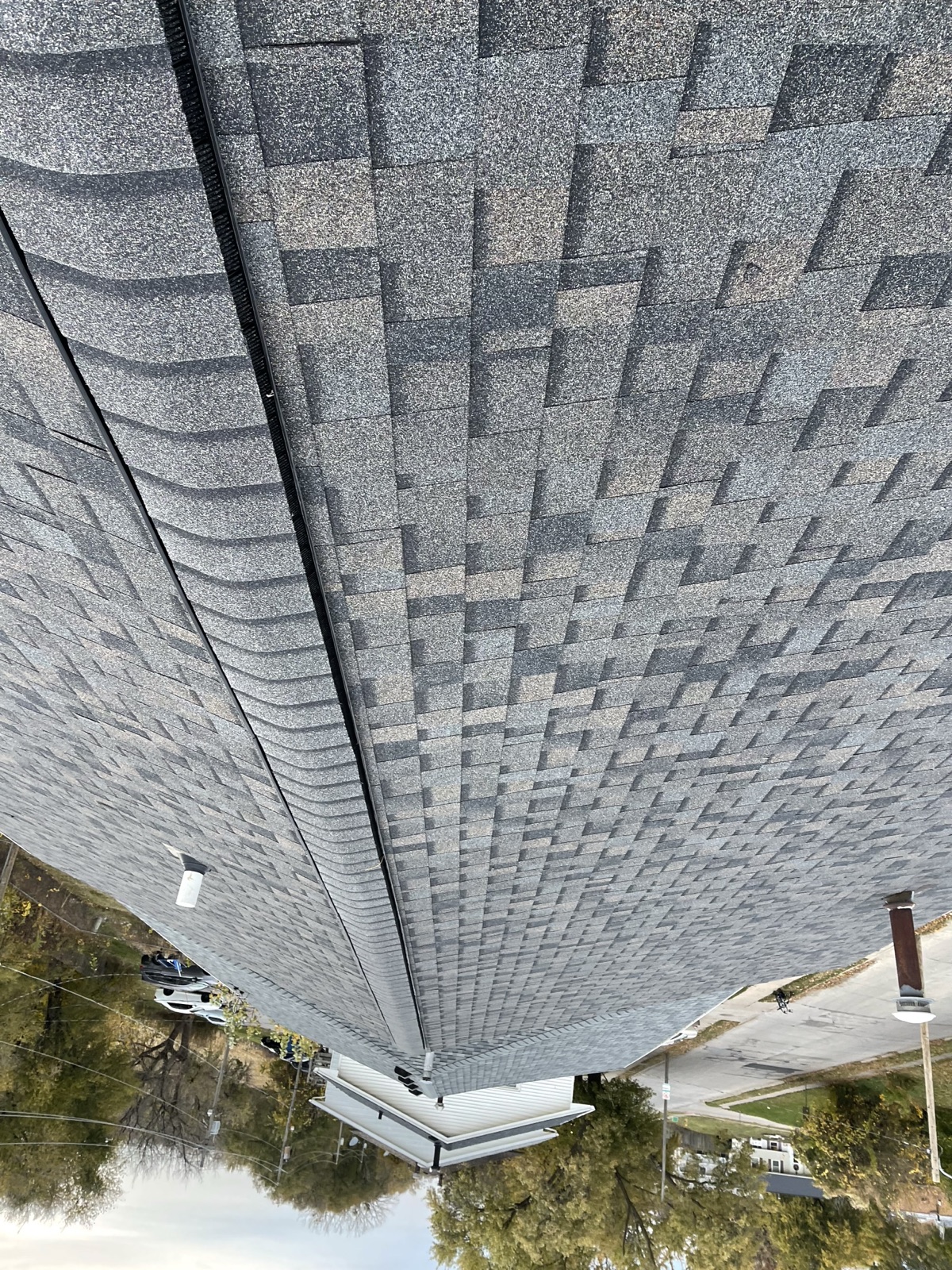Roof deck inspection during a residential roof replacement in Urbandale Iowa by Black Ridge Contracting
